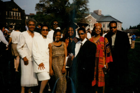 A group of family pose at a graduation.