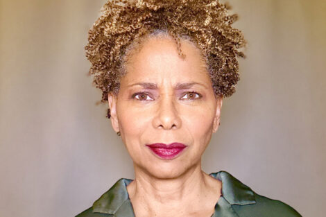 Kim Sykes is wearing a green shirt