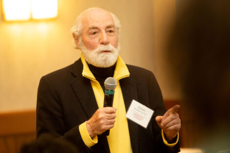 Richard Koplin is talking in a microphone.